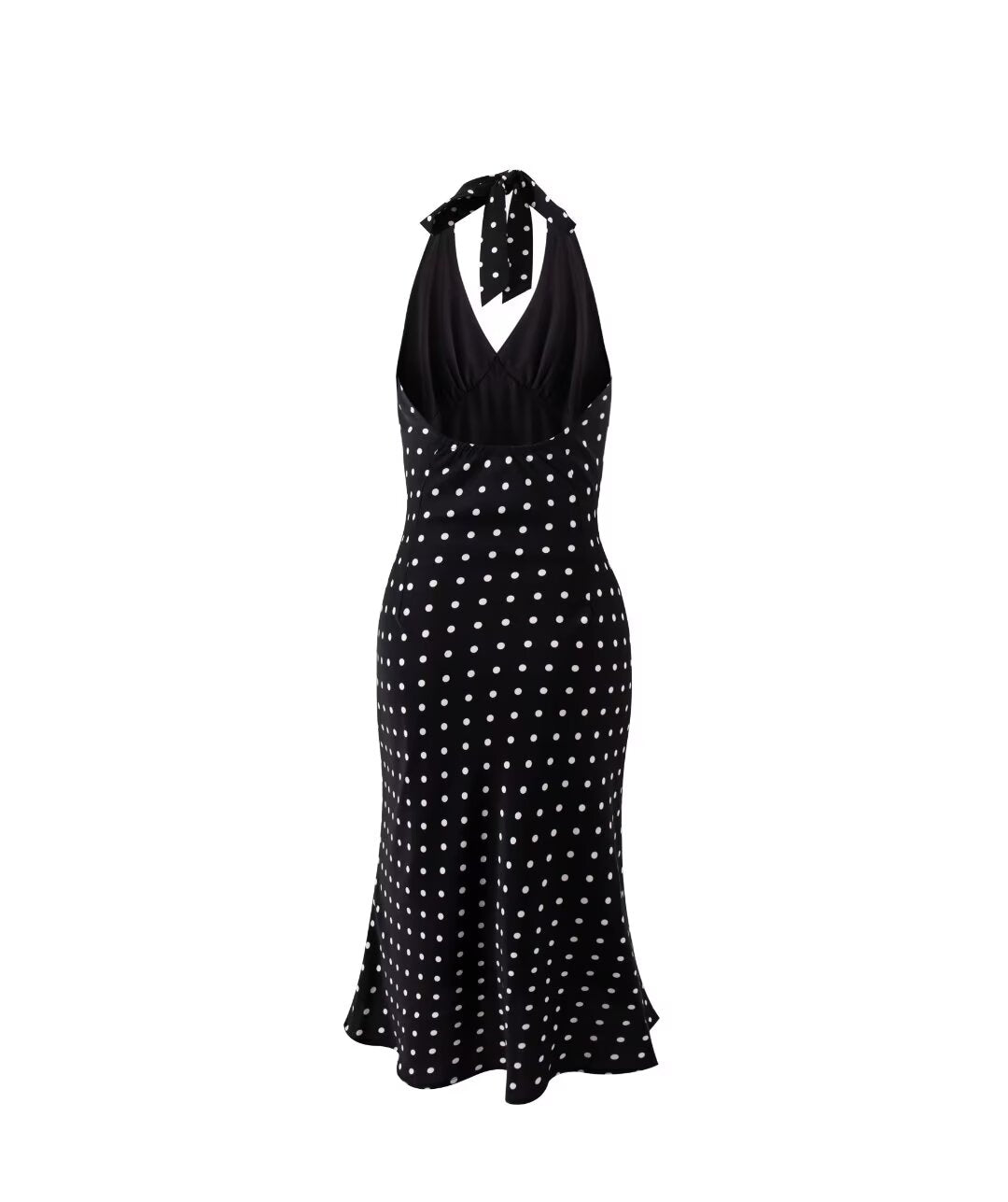 A summer, backless, black dress with white polka dots