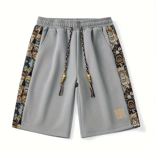 Unisex Shorts im Relaxed Fit mit bestickten Seitenpanelen, Vorderansicht