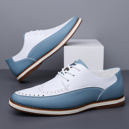 Paar zweifarbige Herren Brogue Lederschuhe nebeneinander